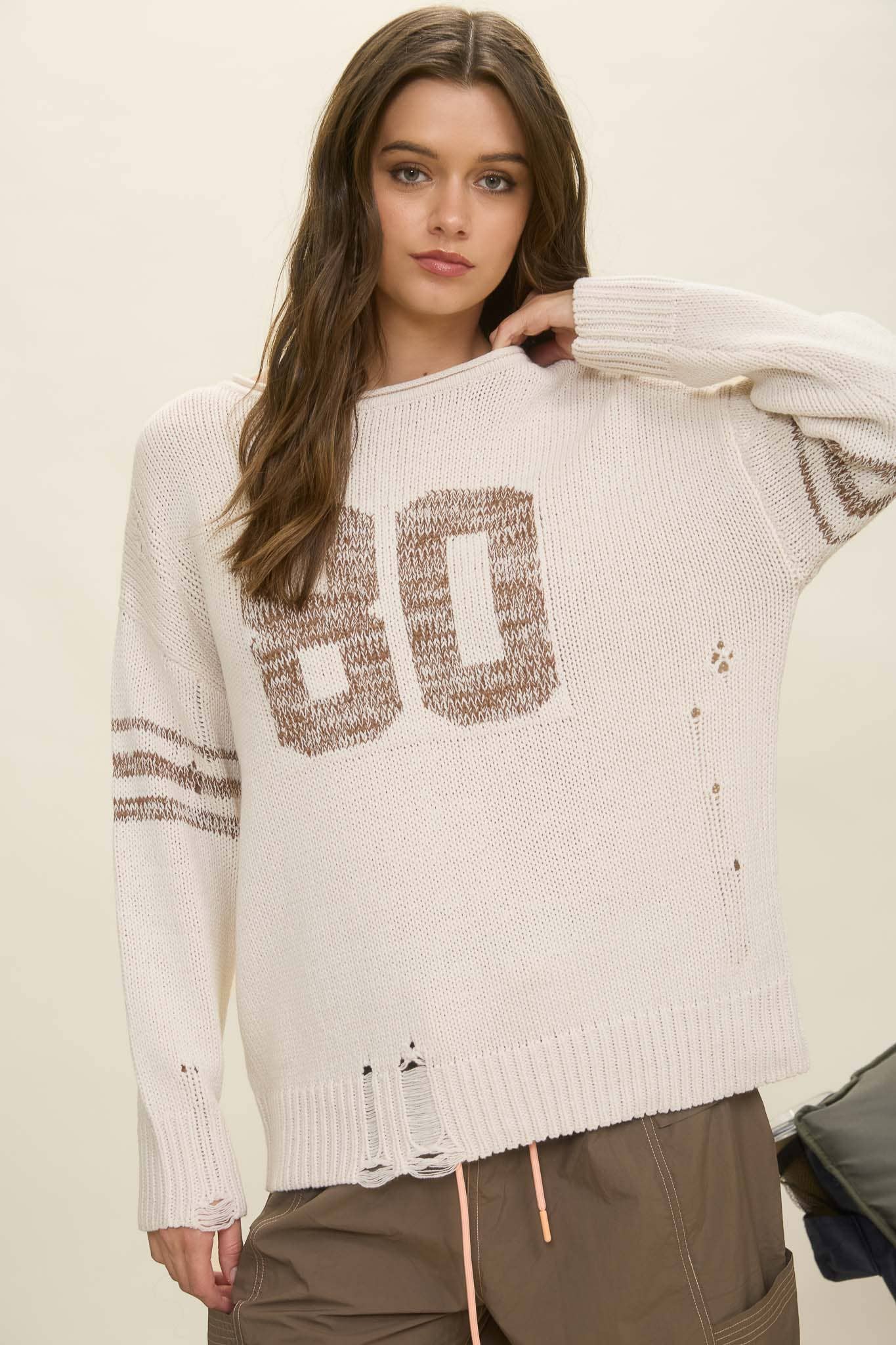 DISTRESSED LONG SLEEVE VARSITY KNIT TOP
